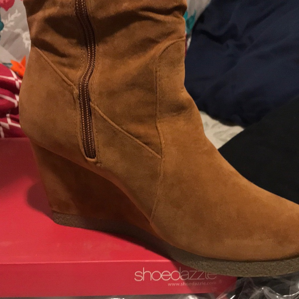 Knee high wedge boots.